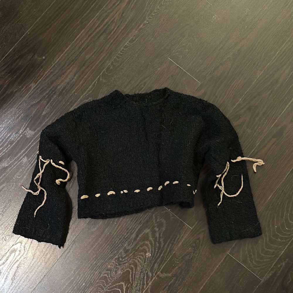 Stylish Black Sweater with Unique Detailing